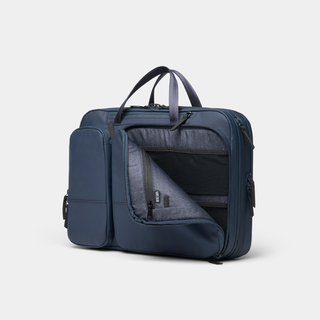 NOMATIC Laptop Bag in navy, angled view with expandable side panel open