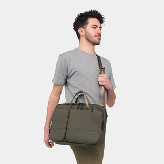 NOMATIC Laptop Bag in olive, worn cross-body over the shoulder, front view
