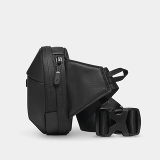 NOMATIC Navigator RS Sling 1L in black, side view showing zipper pockets